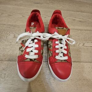 Coach low-top sneakers featuring the brand's iconic signature monogram canvas